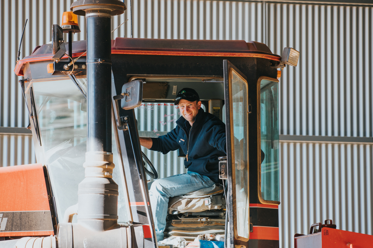 Man sitting in red tractor